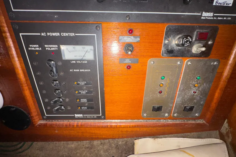 Electrical panel of a 1985 Beneteau First 38 sailboat, featuring AC power controls.