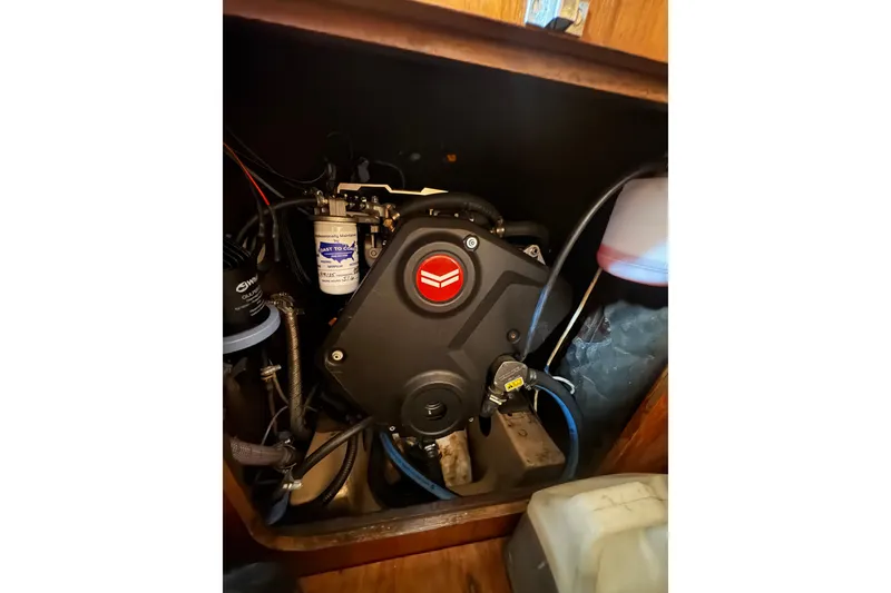 Engine compartment of a 1985 Beneteau First 38 sailboat, showcasing mechanical components.