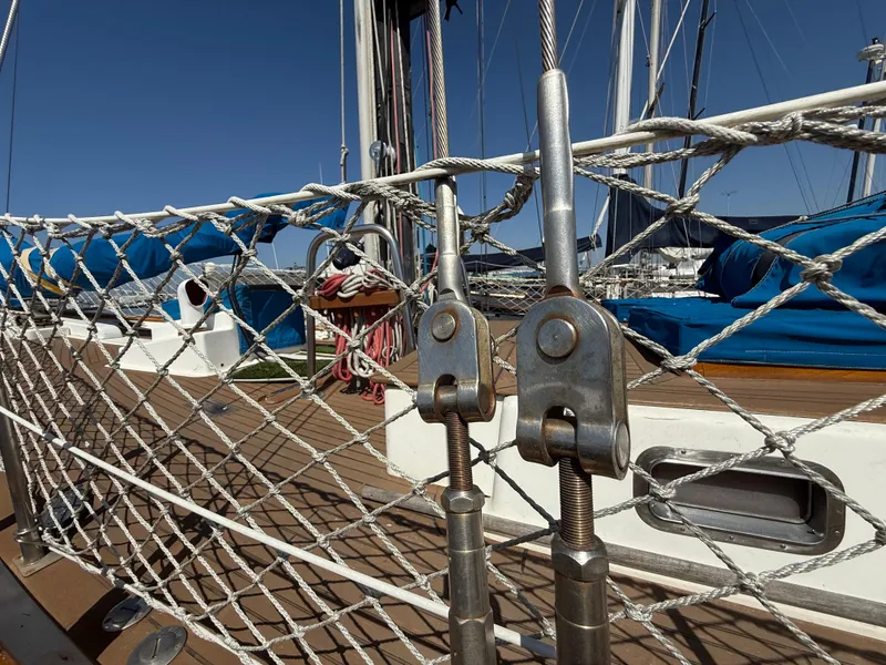 Close-up of 1986 Vagabond 47 sailboat deck with rigging and netting.