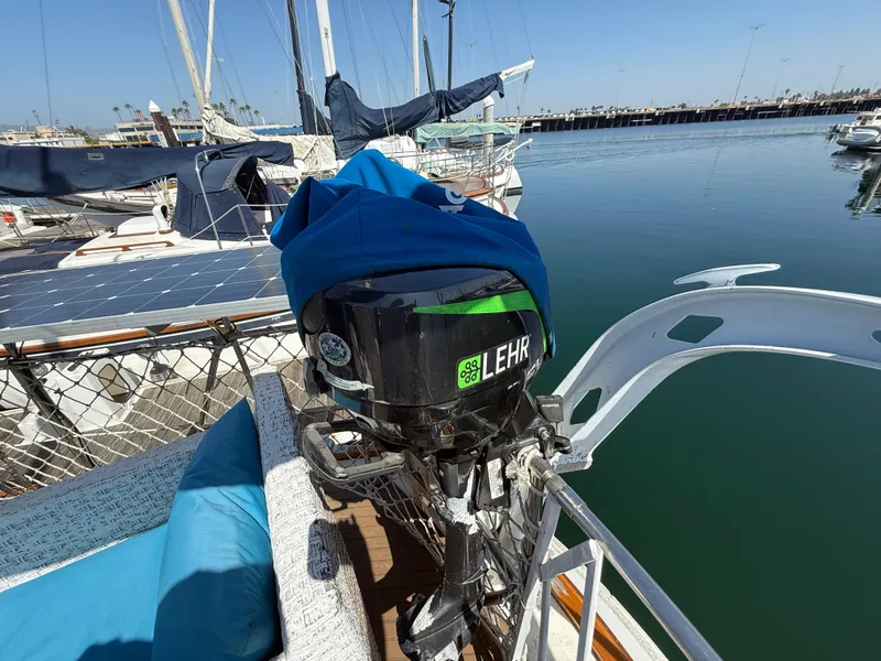 Sailboat with Lehr outboard motor, Vagabond 47, 1986, docked with solar panels visible.