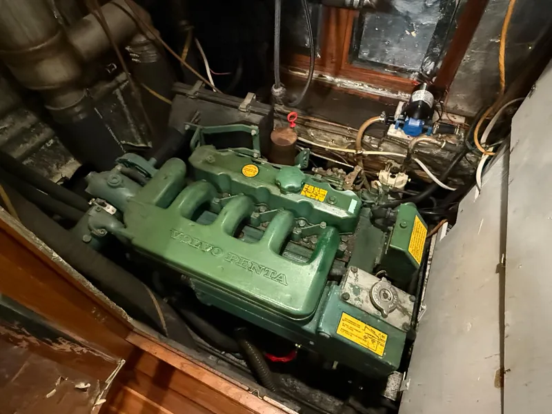 Engine compartment of a 1986 Vagabond 47 sailboat with a Volvo Penta engine.