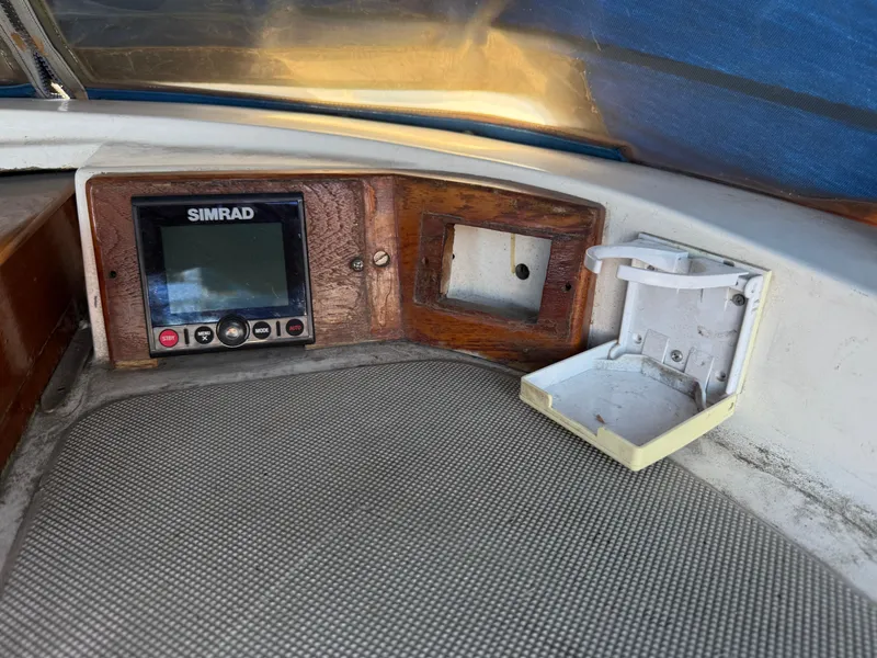 Control panel of a 1986 Vagabond 47 sailboat with Simrad display.