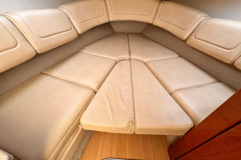 2012 Formula 290 Sun Sport cabin interior with beige cushioned seating.