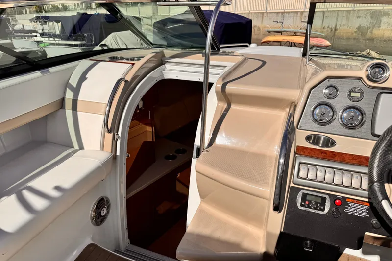 2012 Formula 290 Sun Sport boat interior with dashboard and cabin entrance.