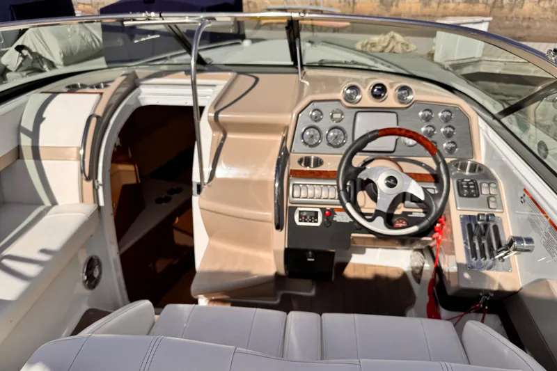 2012 Formula 290 Sun Sport boat cockpit with steering wheel and control panel.