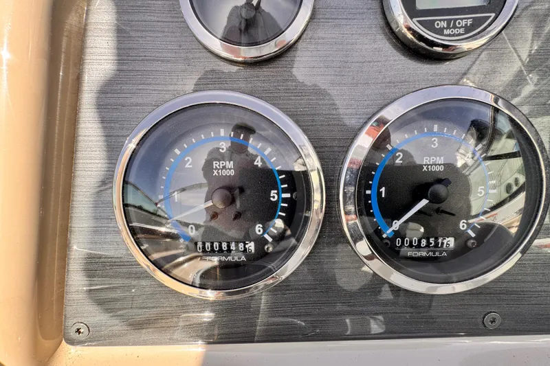 Dashboard gauges of a 2012 Formula 290 Sun Sport boat showing RPM readings.