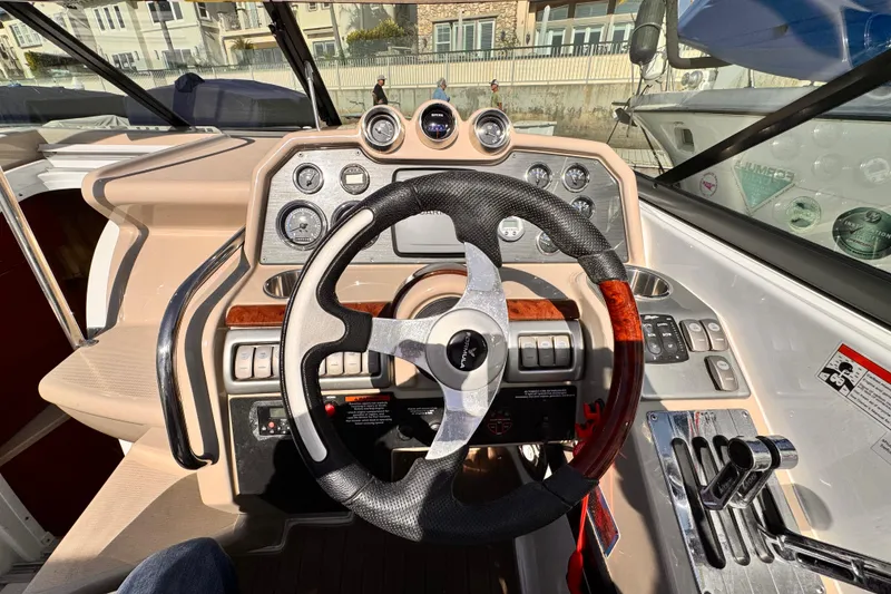 Steering wheel and dashboard of 2012 Formula 290 Sun Sport boat.