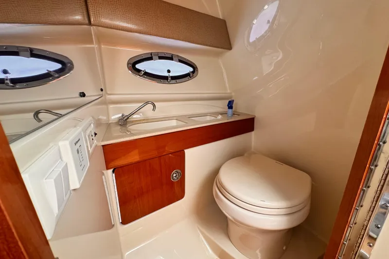 Luxurious bathroom in 2012 Formula 290 Sun Sport boat with modern fixtures.