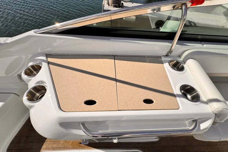 2012 Formula 290 Sun Sport boat with cup holders and storage compartment.