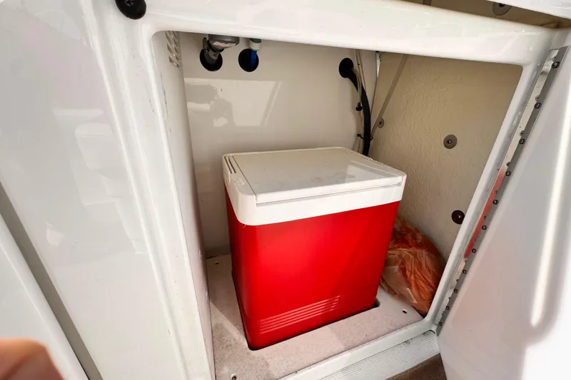 Red cooler inside 2012 Formula 290 Sun Sport storage compartment.
