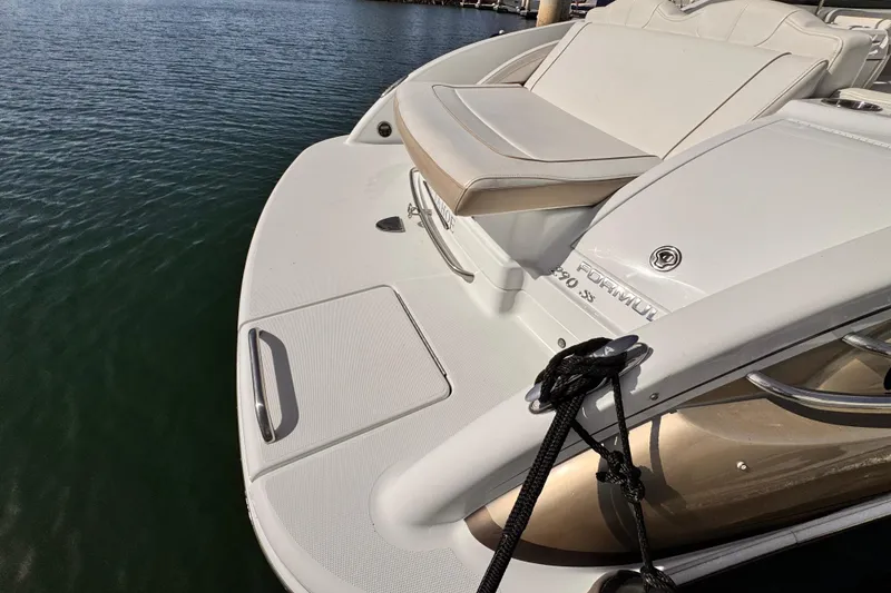 2012 Formula 290 Sun Sport boat docked on calm water.