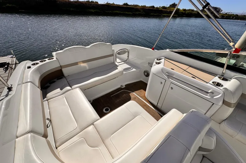 2012 Formula 290 Sun Sport boat interior with white seating and water view.