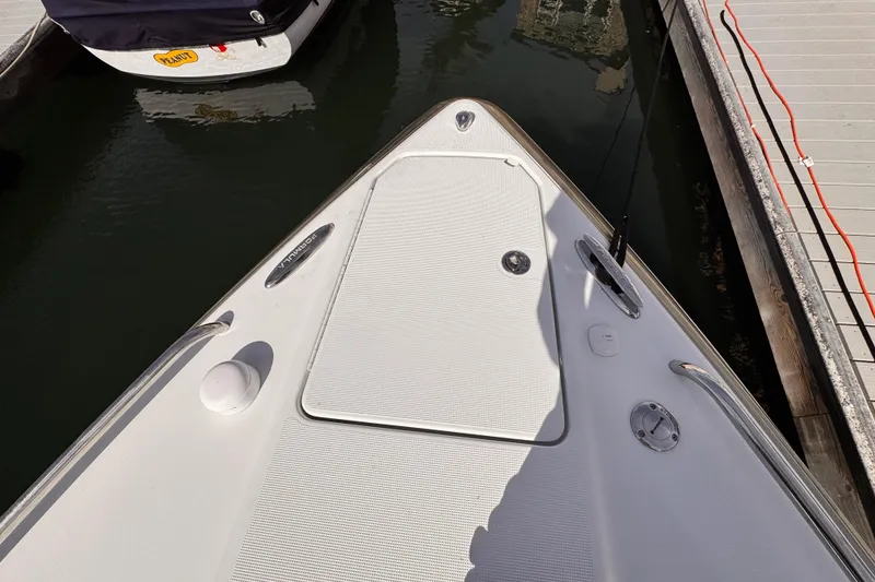 Bow of 2012 Formula 290 Sun Sport boat docked at marina.