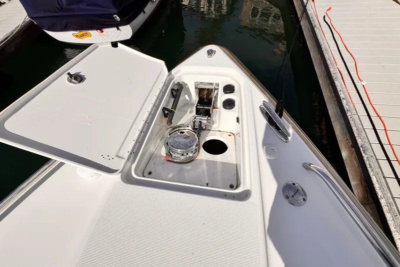 2012 Formula 290 Sun Sport boat anchor compartment at marina dock.