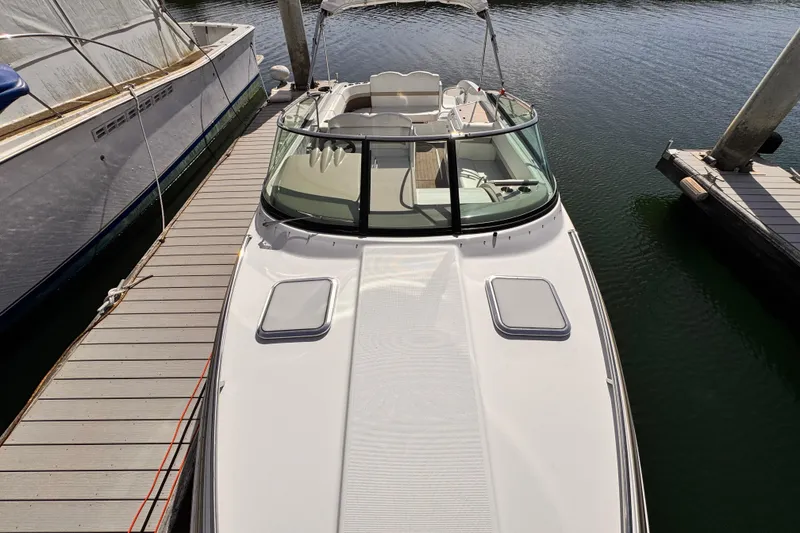2012 Formula 290 Sun Sport boat docked at marina, top view.