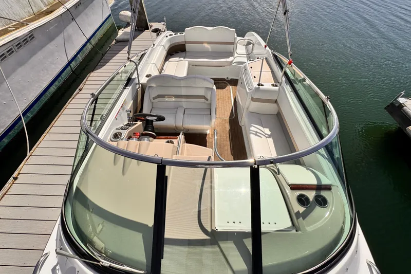 2012 Formula 290 Sun Sport boat docked, featuring spacious seating and sleek design.
