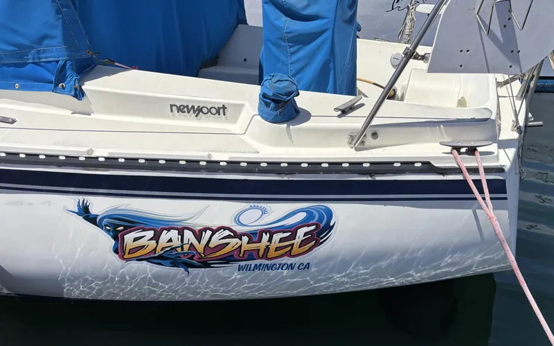 1985 Newport 30 sailboat named "Banshee" docked in Wilmington, CA.