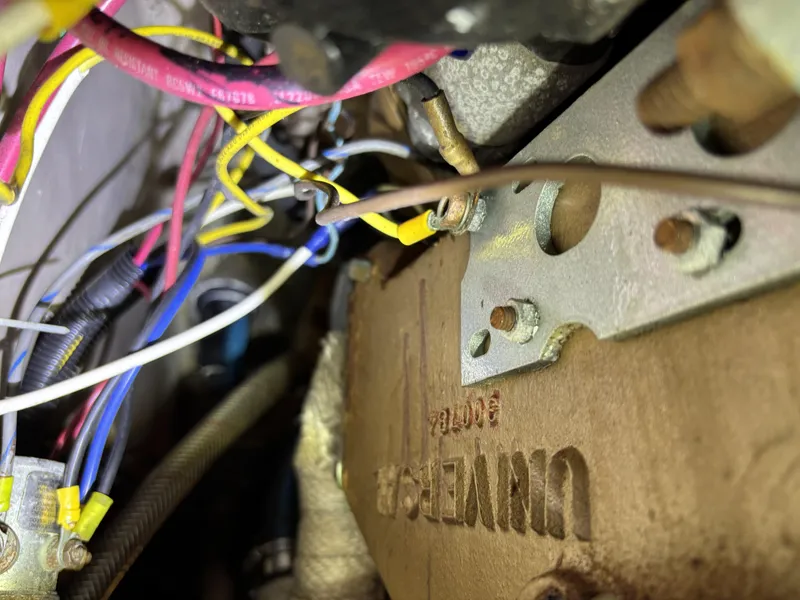 Engine wiring and components of a 1985 Newport 30 boat.