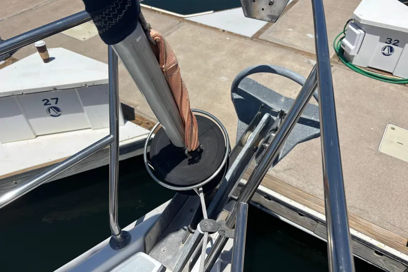 Bow of 1999 Hunter 410 sailboat with anchor and dock view.
