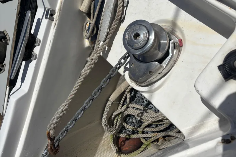 Anchor winch and ropes on a 1999 Hunter 410 sailboat deck.
