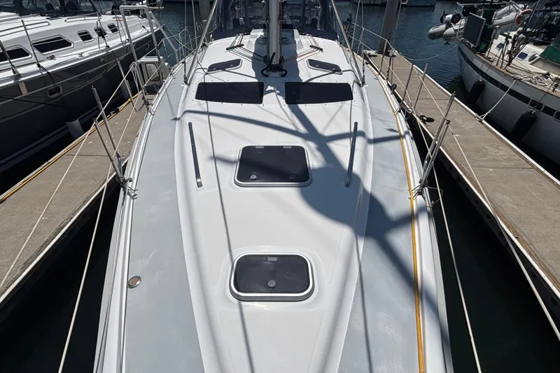 1999 Hunter 410 sailboat docked at marina, top deck view.