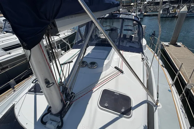 Sailboat deck view of 1999 Hunter 410 model docked at marina.