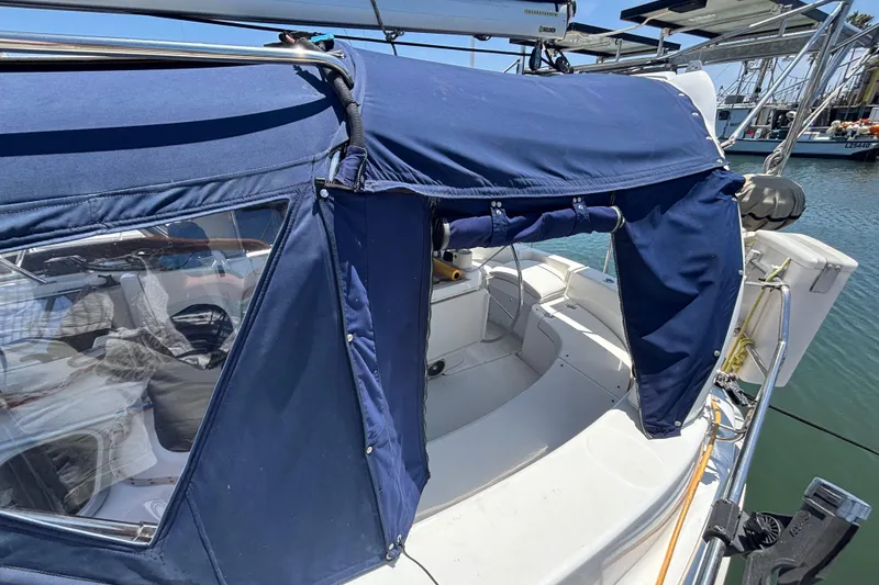 Hunter 410 sailboat cockpit with blue canvas cover, docked in marina, 1999 model.