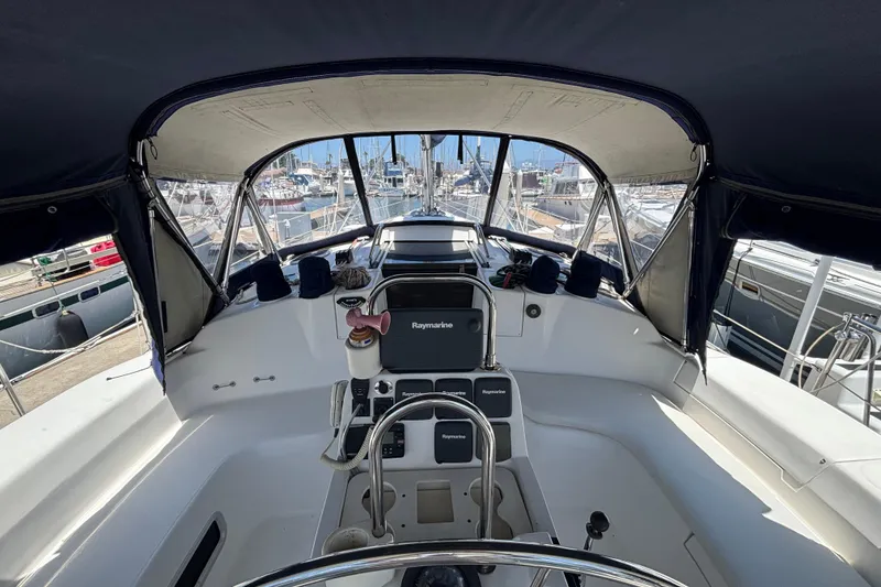 Cockpit view of a 1999 Hunter 410 sailboat docked at a marina.