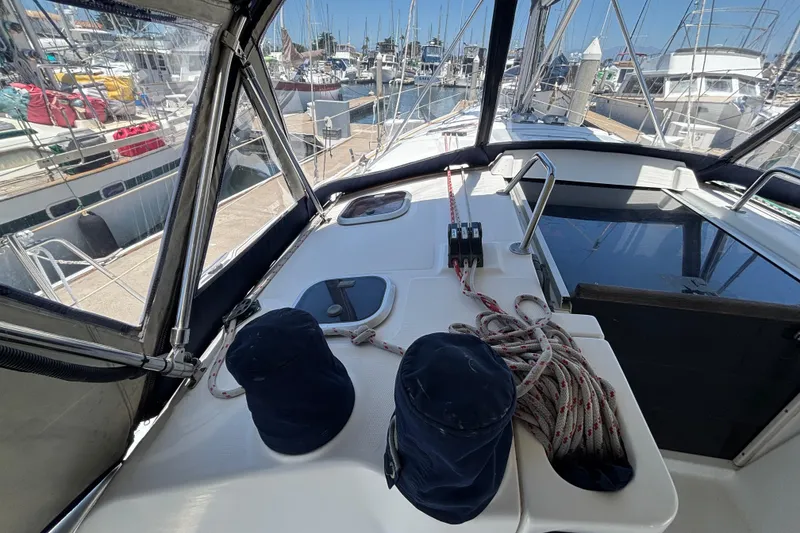 1999 Hunter 410 sailboat cockpit with ropes and marina view.