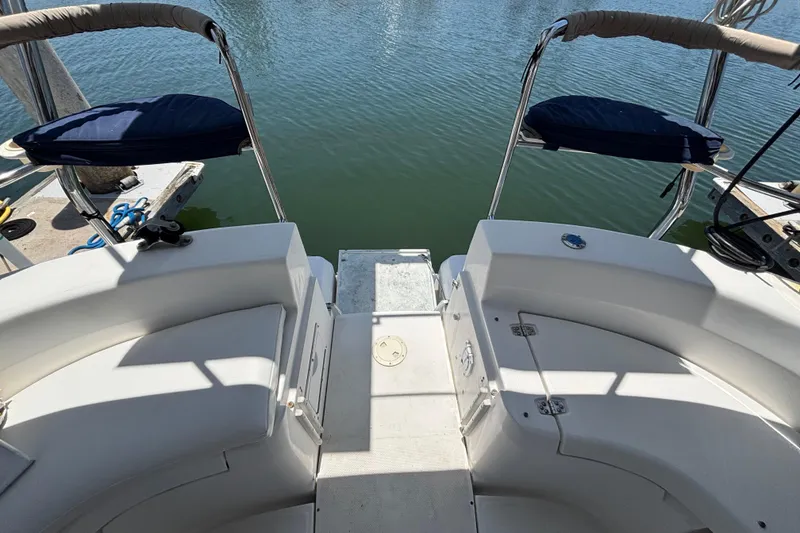 1999 Hunter 410 yacht stern view with seating, overlooking calm water.