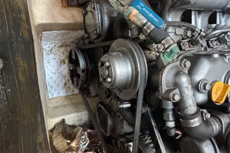 1999 Hunter 410 engine close-up with belts and hoses visible.