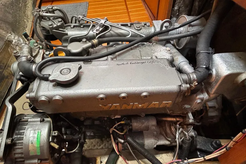 Yanmar engine in a 1999 Hunter 410 sailboat, showcasing detailed mechanical components.