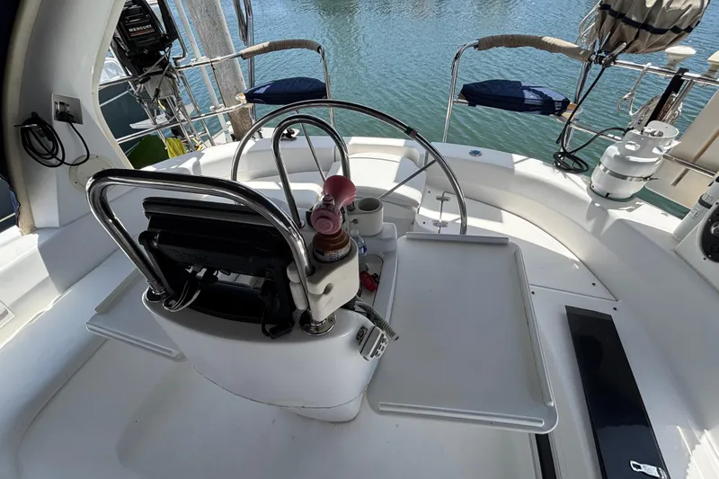 Cockpit of 1999 Hunter 410 sailboat with steering wheel and controls.
