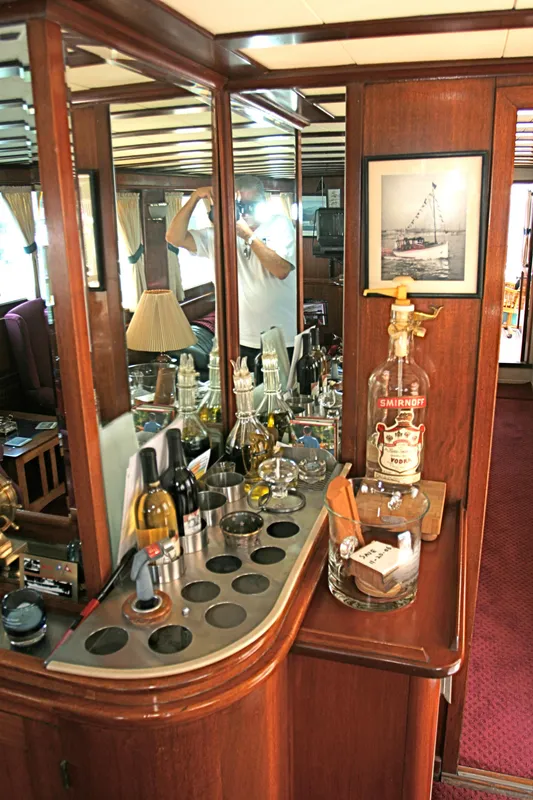 Interior of a classic yacht with bar and mirror, built in 1946.