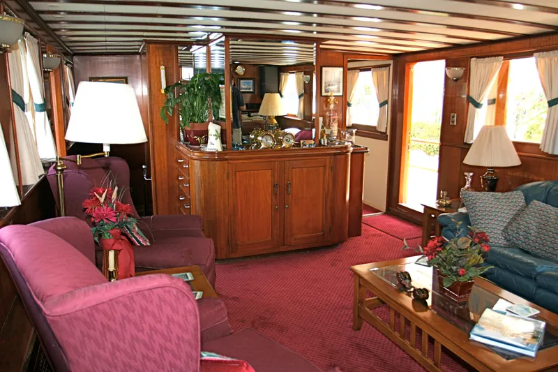 Luxurious interior of a 1946 classic motor yacht with wooden furnishings.
