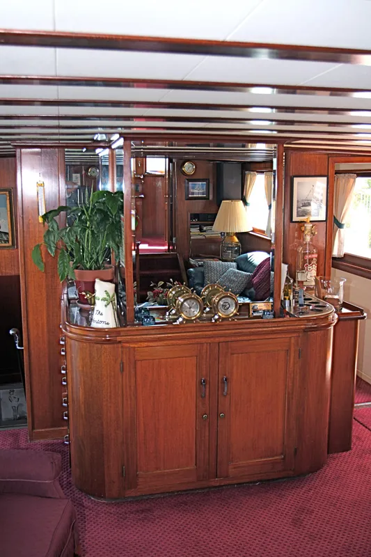 Interior of a classic yacht with wooden furnishings, built in 1946.