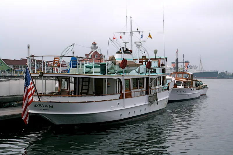 1946 J.M. Martinac yacht docked, American flag displayed.