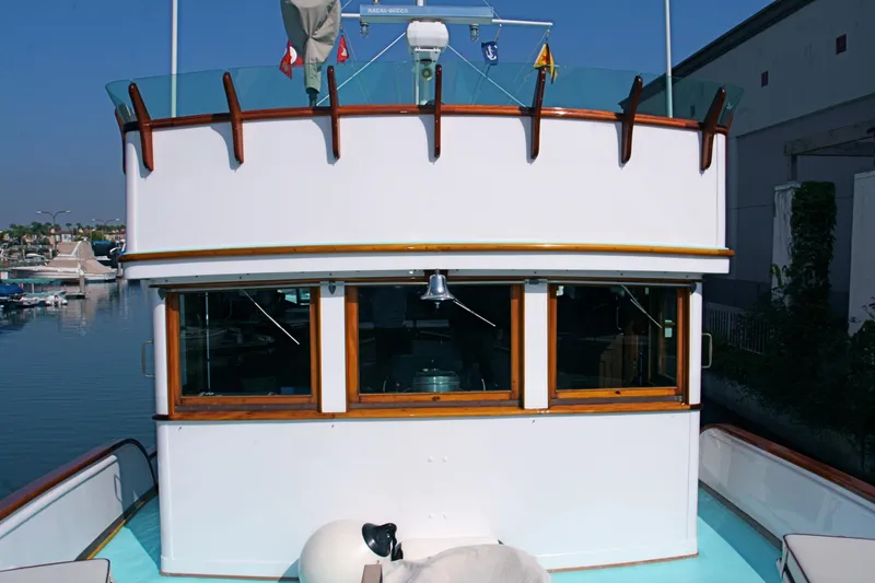 1946 J.M. Martinac Fantail Motor Yacht, front view, harbor background.