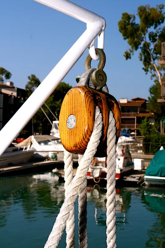 Wooden pulley on a classic yacht in the harbor.