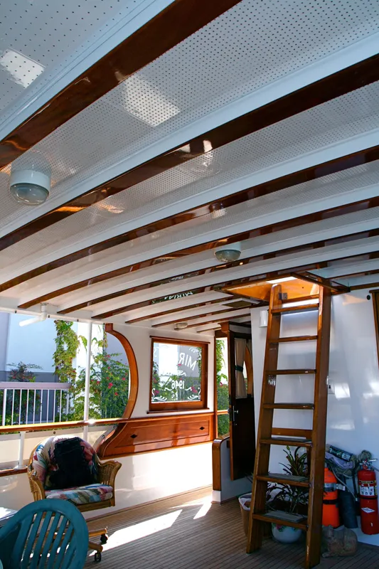 Interior of a classic yacht with wooden accents, built in 1946.