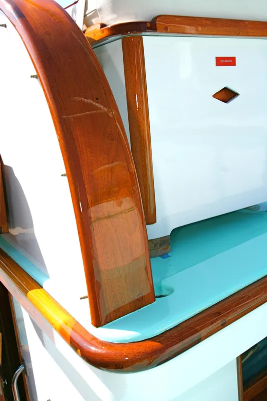Close-up of a 1946 J.M. Martinac classic yacht with wooden trim.