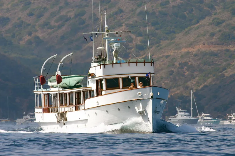 Classic 1946 J.M. Martinac motor yacht cruising on water.