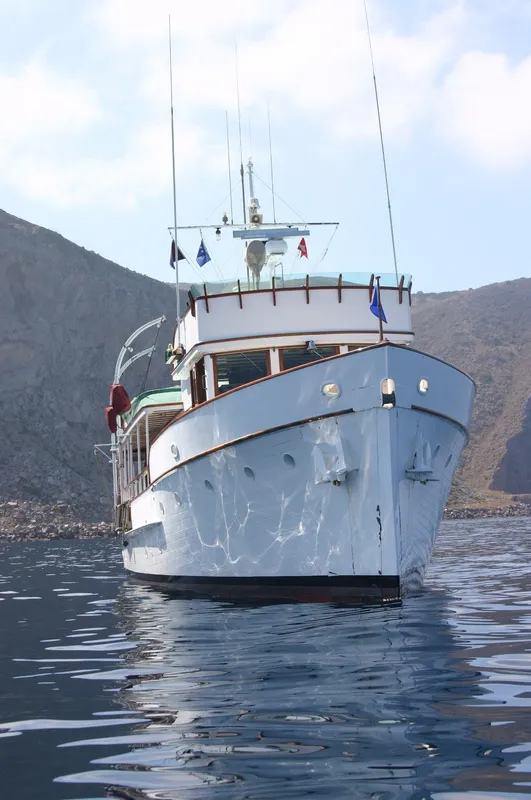 Classic 1946 J.M. Martinac yacht on calm waters.