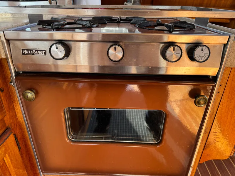 Vintage Hillerange stove and oven in a 1979 Californian LRC Sedan Bridge yacht kitchen.