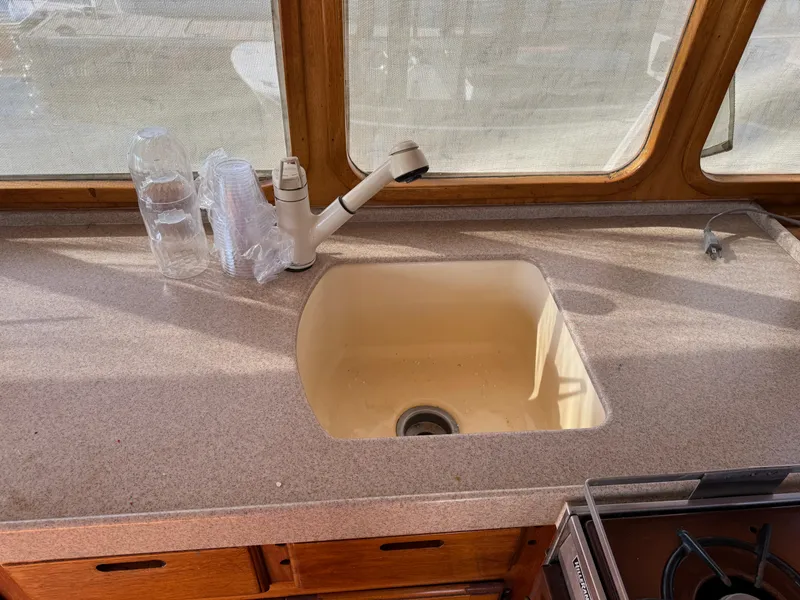 1979 Californian LRC Sedan Bridge kitchen sink with faucet and countertop.