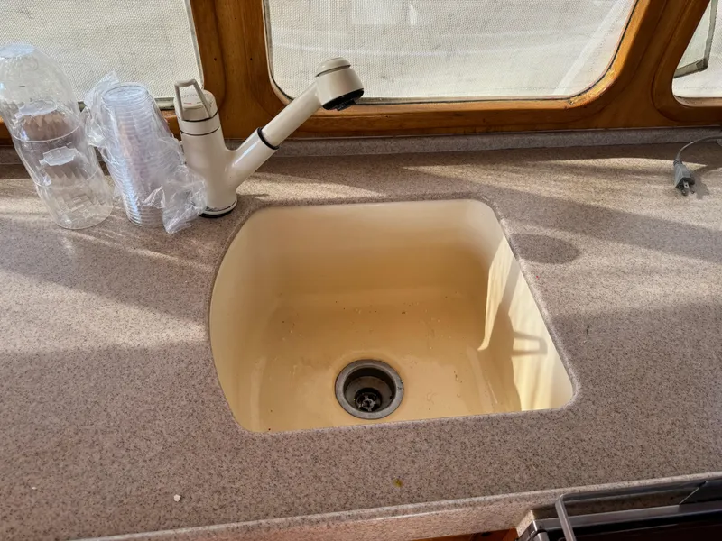 1979 Californian LRC Sedan Bridge kitchen sink with faucet and countertop.