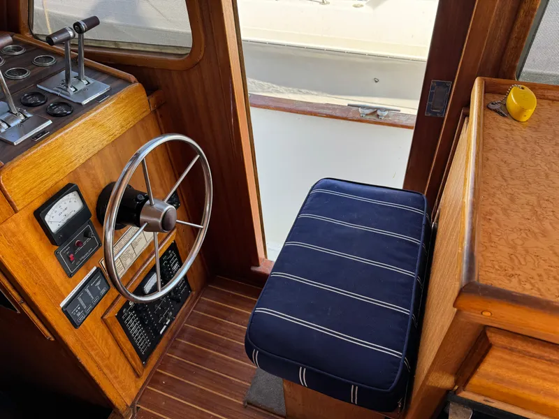 Interior of a 1979 Californian LRC Sedan Bridge, featuring a steering wheel and control panel.