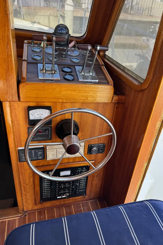 1979 Californian LRC Sedan Bridge helm with wooden dashboard and steering wheel.