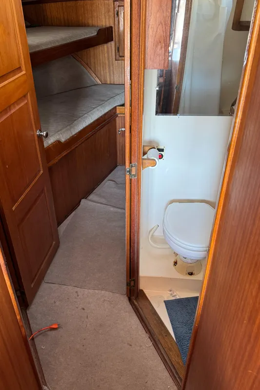 1979 Californian LRC Sedan Bridge interior with bunk beds and compact bathroom.