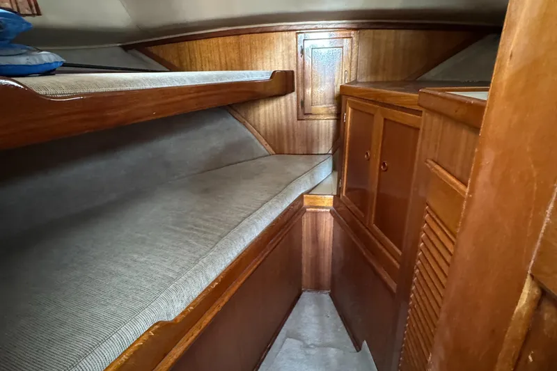 1979 Californian LRC Sedan Bridge cabin with wooden interior and bunk beds.